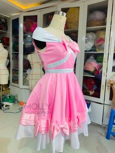 a mannequin is dressed in pink and white