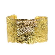 Description Measurements Shipping This beautiful cuff is made from intricate lace that combines different thread weavings and motifs; making the Yvette cuff dimensionally pleasing to the eye. The lace inside this small cuff is French embroidered cotton Calais lace from the 1920s used for corset cover. Wear from day to the evening! Limited edition. Signed and numbered. Made in New York. Cuff size: length (from top edge to bottom scallop) 1 3/4″ width (side to side- horizontally) 2 3/8″ Please all Elegant Gold Cuff Bracelet For Ceremonial Use, Ornate Gold Cuff Bracelet With Filigree, Ornate Gold Filigree Cuff Bracelet, Elegant Adjustable Cuff Bracelet For Ceremonial Occasions, Handmade Gold Cuff Bracelet For Wedding, Adjustable Elegant Cuff Bracelet For Ceremonial Occasions, Heirloom Gold Cuff Bracelet Gift, Festive Handmade Gold Cuff Bracelet, Gold Filigree Cuff Bracelet As Gift