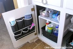 an open refrigerator door that has various items in the bins and bottles on it