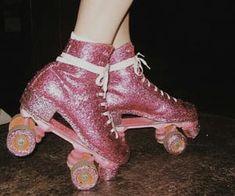 a pair of pink roller skates with sequins on them