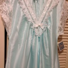 Gilligan O'malley Beautiful Night Gown Trimmed With Lace. Pale Aqua Blue With White Lace, At Neckline, Bodice, Sleeves And Hem Line. Size Is Small. 100 % Polyester, But The Look And Feel Of Satin. Hemline Is A Semi-Circle Style, Forming A V Design. Length Is 47 Inches At Center. Simply Beautiful ! ! New With Tags. Blue Sleepwear For Wedding Night In Spring, Light Blue Sleepwear For Wedding Night In Spring, Blue Lace Trim Nightgown For Pajama Party, Blue Satin V-neck Nightgown, Blue Satin Nightgown For Wedding Night, Blue Satin Nightgown For Bedtime, Beautiful Nightgown, V Design, Pale Aqua