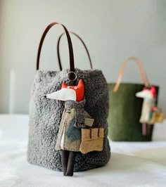 two small purses made to look like animals