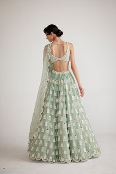 Powder mint green chandelier pearl lehenga clubbed with an intricately hand-embroidered blouse and dupatta.From Vvani Vats Piroi's collection.DELIVERY TIMEPlease allow 8-12 weeks for your outfit to arrive.FABRIC DETAILSOrganza, GeorgetteProfessional cleaning only. Pearl Lehenga, Vani Vats, Green Chandelier, Hand Embroidered Blouse, Green Chandeliers, Lehenga Dupatta, Cutout Blouse, Green Lehenga, Indian Wedding Wear