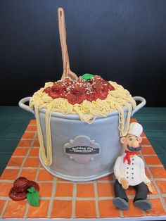 a cake made to look like a pot of spaghetti