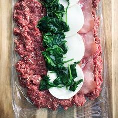 meat, eggs and spinach in a plastic bag