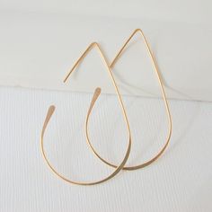 Looking for a pair of hoops that you can wear everyday, looks great at work and play? My hoop collection is made with sterling silver, 14k gold fill or rose gold fill, no plated materials, these will last a lifetime and the craftsmanship is guaranteed for life.  So lightweight, you won't even know they are there.  I am pretty confident that there is a style and size that fits Your style!! Returns welcome if not fully satisfied. Find Your Pair Today! Free Shipping and Free Returns!Medium Teardrop Minimalist Drop Hoop Earrings With Ear Wire, Everyday Rose Gold Teardrop Hoop Earrings, Hoop Earrings Medium, Diy Wire Earrings, Threader Earrings Gold, Earrings Gold Hoop, Open Hoop Earrings, Handmade Wire Jewelry, Threader Earrings