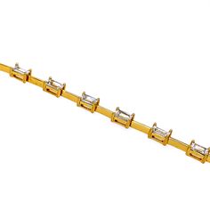 Make a fashion statement with this trendy and elegant baguette bracelet! Sterling Silver 14k Gold Plated Hinge Clasp SIZE: 7" Style Code:PJBR239 Gold Baguette Diamond Bracelet In Classic Style, Classic Gold Baguette Diamond Bracelet, Modern Baguette Bracelets For Formal Occasions, Gold Baguette Tennis Bracelet For Formal Occasions, Gold Baguette Cut Diamond Bracelet, Gold Baguette Diamond Bracelet For Formal Occasions, Modern Gold Baguette Bracelet, Baguette Bracelet, Bracelet Sterling Silver