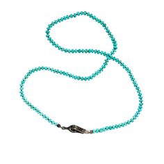 Our diamond-studded signature handmade clasp, an unexpected design element, is best worn front center or to the side of this beaded necklace. This classic necklace silhouette can be worn solo or layered with other beaded necklaces or amulets from our collection. Designed and crafted in our local New York City workshop with attention to every detail. Elegant Turquoise Necklace With Lobster Clasp, Elegant Turquoise Beaded Necklace Hand-strung, Elegant Hand-strung Turquoise Beaded Necklaces, Elegant Single Strand Turquoise Beaded Necklaces, Elegant Turquoise Single Strand Beaded Necklaces, Elegant Adjustable Turquoise Necklace With Faceted Beads, Black Diamond Studs, Classic Necklace, American Turquoise