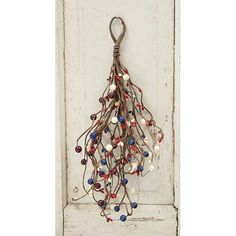 a white door with a bunch of beads hanging from it