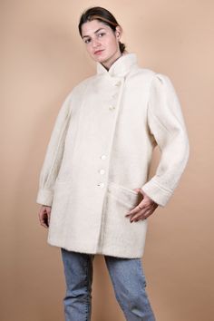 "90s elegant white wool coat. M E A S U R E M E N T S - taken seam to seam lying flat - not doubled Armpit to armpit 21,5\"/55 cm Length 33\"/83 cm Sleeve 24\"/61 cm Shoulder to Shoulder: 19,5\"/49 cm L size In good vintage condition Made of 18% mohair wool, 56% wool, 26% viscose You will receive the exact item shown in the picture." White Classic Wool Coat, Classic White Wool Coat, Classic White Wool Outerwear, Oversized White Wool Outerwear, White Wool Outerwear With Buttons, Cream Wool Coat With Button Closure, White Wool Coat For Winter, Classic Long-sleeved Cream Wool Coat, Classic Cream Wool Coat With Long Sleeves