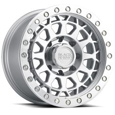 an aluminum wheel with rivets on the front and back wheels, all in silver