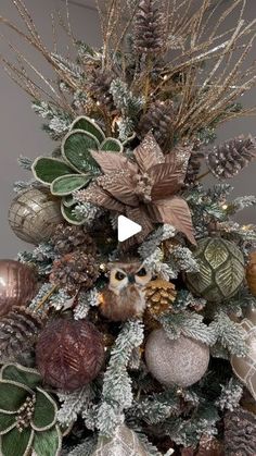 a christmas tree decorated with ornaments and pine cones