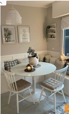 a white table and chairs in a room