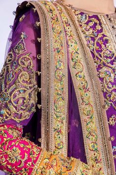 Pakistani Mehndi Dress in an Open Jacket and Sharara Style is a traditional masterpiece Emblazoned with Zardosi, Embroidery, and Crystals. Fast shipping.