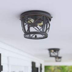 an outdoor light fixture hanging from the ceiling