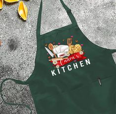 a green apron that has some food on it