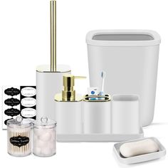 bathroom accessories including toothbrushes, soap dispenser and cups