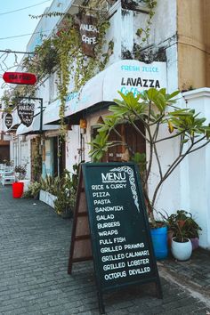 a menu board on the side of a building