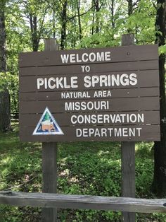 a welcome sign for pickle springs state park