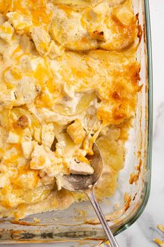 a casserole dish with chicken and cheese in it, ready to be eaten