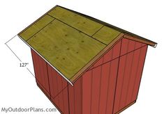 the side view of a red shed with measurements for the roof and sides on it