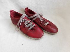 "Nothing says 'fun' like a pair of red leather kicks. Cute when paired with just about anything. Lace up red leather tennis shoes were made in Germany and are free of distressing and stains. Measurements: Heel to toe:9 3/8\" Ball of foot:3\" Check out other items in my shop @: https://www.etsy.com/shop/RagandBonesFinds" Red Leather Sneakers For Spring, Vintage Tennis Shoes, Leather Tennis Shoes, Grunge Boots, Costume Boots, Festival Boots, Lace Costume, Cosplay Boots, Boho Boots