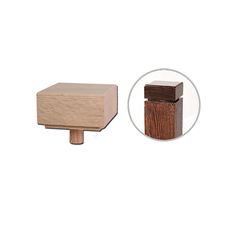 a wooden block with a hole in the middle and a piece of wood next to it