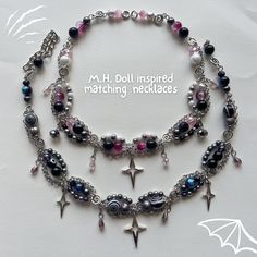 Complex beaded necklaces inspired by MH dolls. An edgy and elegant look for the MH doll fans. Each necklace is inspired by the gothic aesthetics of the characters. Easy to incorporate day-to-day and on special occasions. Aesthetic: Dainty, chained choker, stars, gothic, stainless silver, hearts, locket Handmade one-of-a-kind beaded necklaces for gifting to others or yourself <3 Instagram: lilisliltrinkets Tiktok: lilisliltrinkets Gothic Pearl Necklace, Silver Choker Necklace For Cosplay, Handmade Punk Necklaces For Alternative Fashion, Punk Handmade Necklace For Alternative Fashion, Punk Handmade Necklaces For Alternative Fashion, Handmade Choker Necklace For Alternative Fashion, Fantasy Choker Necklace For Cosplay, Fantasy Style Cosplay Choker Necklace, Handmade Punk Necklaces For Cosplay