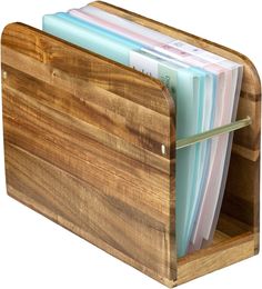 a wooden file holder with files in it