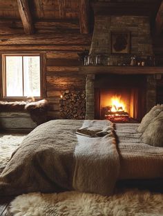 a bedroom with a fire place in the fireplace and sheepskin rugs on the floor