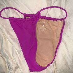 Never Worn Fits Small To Medium High Rise Cheeky Pink Seamless Tankini For The Beach, Pink Seamless Tankini For Sunbathing, Purple Stretch Beachwear Swimwear, Stretch Purple Beachwear Swimwear, Casual Purple Swimwear For Beach, Purple Stretch Swimwear For Vacation, Casual Purple Swimwear With Triangle Top, Purple Stretch Swimwear For Beach Party, Summer Swimming Bottoms With Built-in Bra