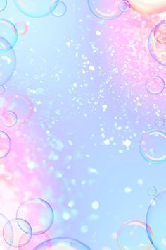 soap bubbles floating in the air on a blue and pink background