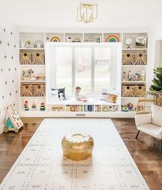 a living room filled with furniture and lots of shelves full of books on top of them