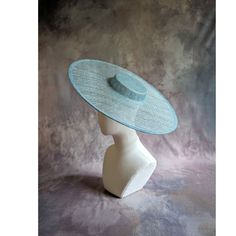 One cartwheel woven sinamay straw hat base in light blue / robins egg that measures approximately 17.25" (43.8cm) in diameter. Crown is 1.25" (3cm) high. The edges of the brim are finished in wired sinamay. The multi-layer stiffened sinamay straw has a great sturdy weave and provides excellent support for your millinery creations. This is NOT a ready to wear finished hat and will not stay on your head unless you add a head band or elastic to wear. Add embellishments of your choice. A nice high quality base - I know you'll be pleased! This hat base is listed separately in lots of different colors. Check my listings for those... Lots of hat bases and millinery supplies listed in my shop   www.etsy.com/shop/apinkswan  ! Thanks for looking - feel free to convo me with any questions you may hav Adjustable Blue Boater Hat For Summer, Blue Wide Brim Straw Hat, Blue Fitted Fascinator For Beach, Blue Boater Hat With Curved Brim For Summer, Fitted Turquoise Summer Hat, Turquoise Spring Racing Hat, Turquoise Fitted Summer Hat, Blue Curved Brim Fascinator For Beach, Blue Curved Brim Fascinator For The Beach