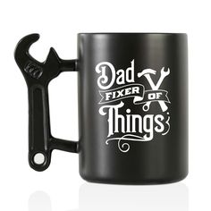 a black coffee mug with the words dad and wrench on it that says fix or things