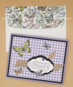 two greeting cards with butterflies on them, one is purple and the other is white