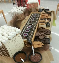 a buffet table filled with chocolates and marshmallows