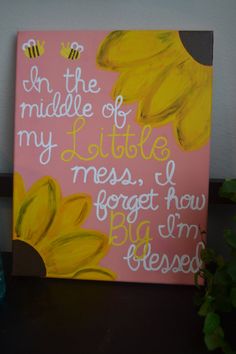 a pink and yellow painting with words written on it