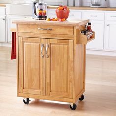 a kitchen island cart with wheels on it