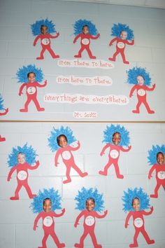 a bulletin board with pictures of people in red and blue costumes