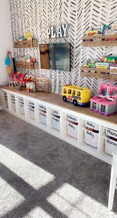 a playroom with toy cars and toys on the shelves, along with other storage bins