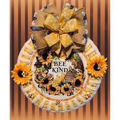 a bee kind of wreath with sunflowers and a honeybee on the front