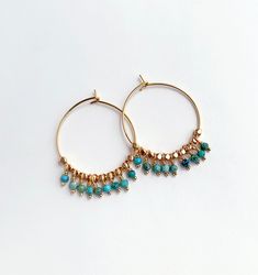 Summery turquoise and gold hoops. Great bohemian vibe for long summer days. + Turquoise. 14K Gold Fill Hoops. 14K Gold Plate Beads. + Length: 1.5 inches. + Earrings are ready to ship. + Your jewelry will come in a jewelry box, tied with a ribbon. ➤➤ Have a question about this product, reach out to me here ➙ https://www.etsy.com/conversations/new?with_id=9057464&referring_id=5772224&referring_type=shop&recipient_id=9057464 ➤➤ Check out our other earrings: http://www.etsy.com/shop/laurastark?secti Bohemian Turquoise Hoop Earrings Nickel Free, Turquoise Bohemian 14k Gold-filled Earrings, Turquoise 14k Gold Filled Bohemian Earrings, Bohemian Turquoise 14k Gold-filled Earrings, Bohemian Turquoise 14k Gold Filled Earrings, Turquoise Gold Bohemian Earrings, Turquoise Hoop Earrings For Summer, Bohemian 14k Gold Filled Hoop Earrings, Small Bohemian 14k Gold Filled Hoop Earrings