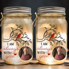 two mason jars with the words i am always with you and an image of a cardinal