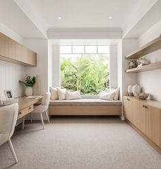 a bedroom with a window seat and desk