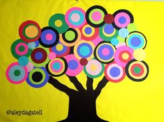 a tree made out of circles on a yellow background