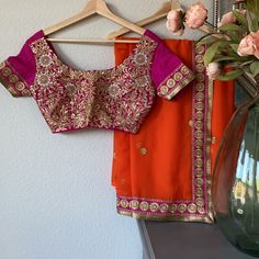 It’s Wedding Season! Worn Once, In Excellent Condition! Blouse Pit To Pit Is 17.5” Blouse And Saree Only Belt And Purse Not Included This Is One Of My Favorite And Really Hard To Let It Go I Wore It With A Different Blouse Since The One That Came With Didn’t Fit. Pink Blouse For Wedding, Fitted Pink Blouse Piece For Celebration, Fitted Orange Saree For Wedding, Pink Blouse With Dupatta For Wedding, Fitted Orange Blouse For Wedding, Elegant Orange Blouse Piece For Wedding, Saree And Blouse, Let It Go, Orange Pink