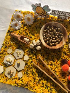 a table topped with lots of food and wooden spoons