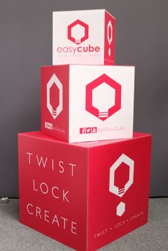 three red and white boxes stacked on top of each other with the words twist lock create