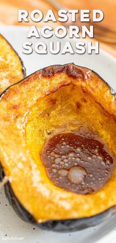 roasted acorn squash on a white plate with text overlay that reads roasted acorn squash